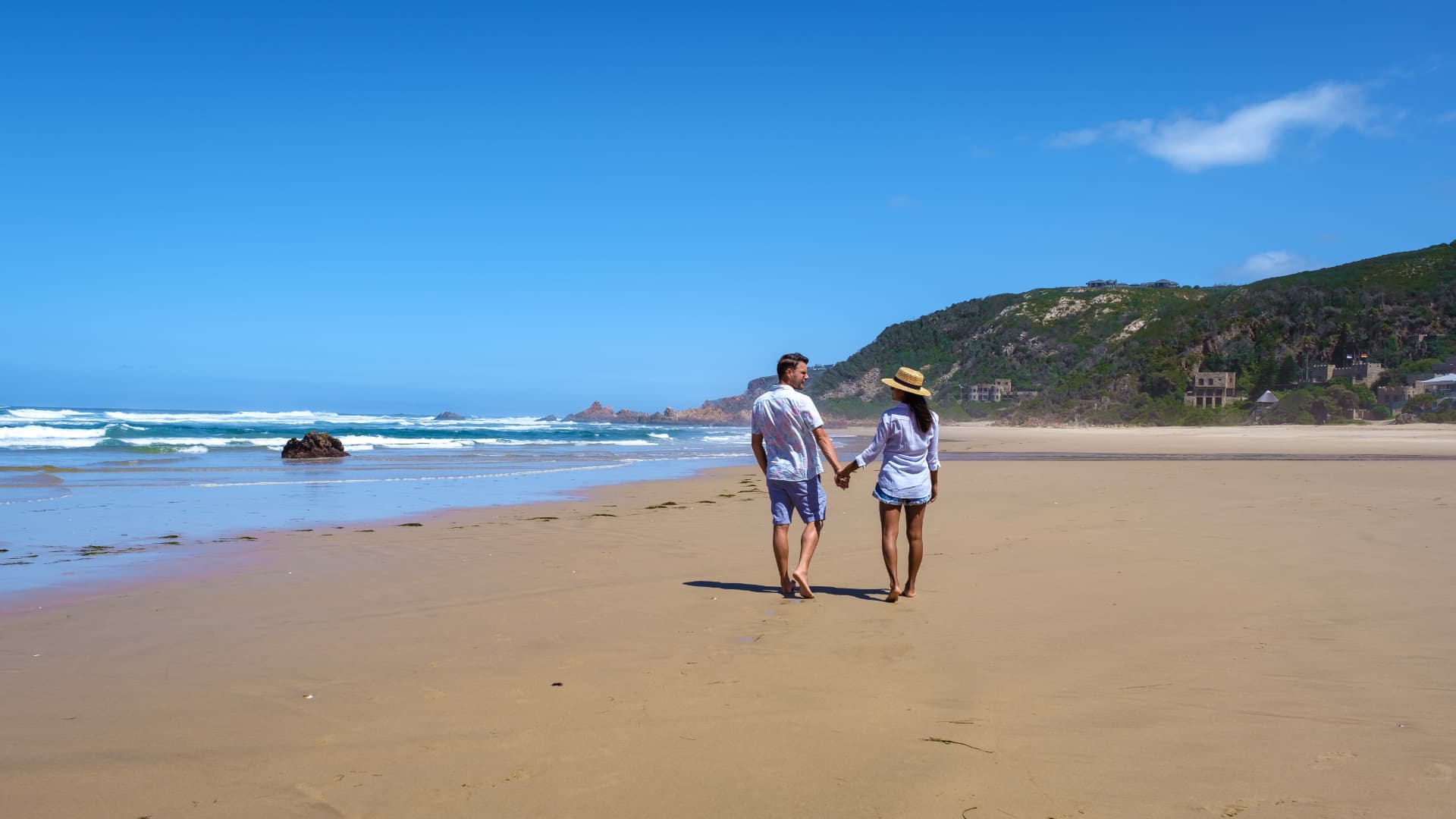 Walking on a wide Garden Route beach