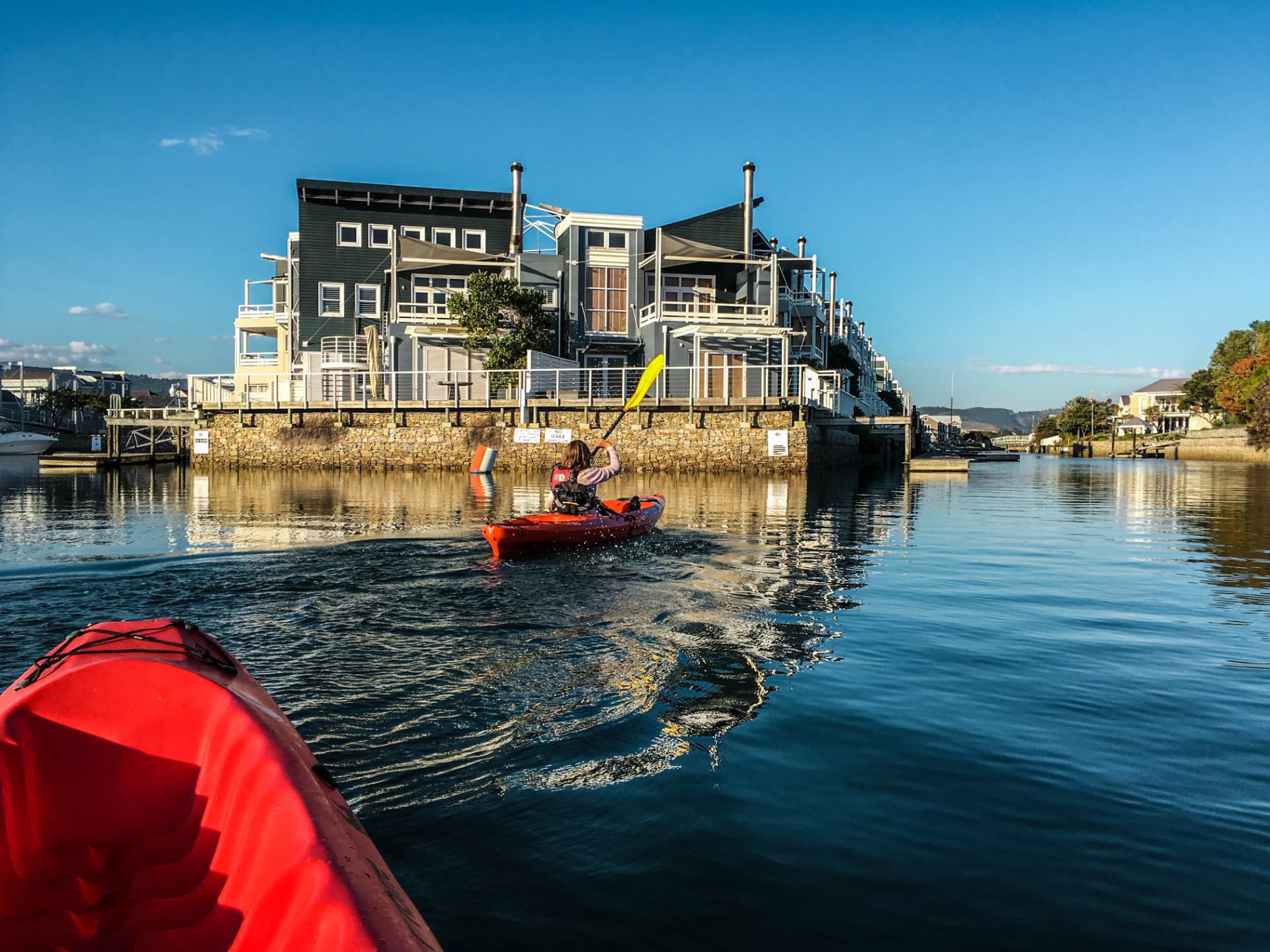 Kayaking the canals past waterside homes on Thesen Island